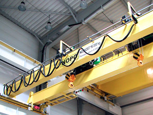 An Overhead Crane equiped with a Conductix-Wampfler C-Rail Cable Festoon System