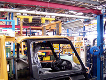 Overhead Monorail System with hydropneumatic swivel and lifting station in a paint shop and the assembly area of a car cabin manufacturer